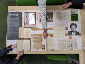 exhibition objects and mock up captions laid out on a table